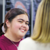 Yiman/Iman and Warrabal student, Ciara Ransome, speaking with APS staff at the Careers Expo.