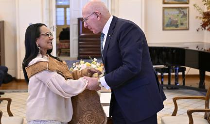 Image of The Hon Linda Burney MP with His Excellency General the Honourable David Hurley AC DSC (Retd) being sworn in at Government House. Minister Burney is wearing a kangaroo skin cloak over her shoulders